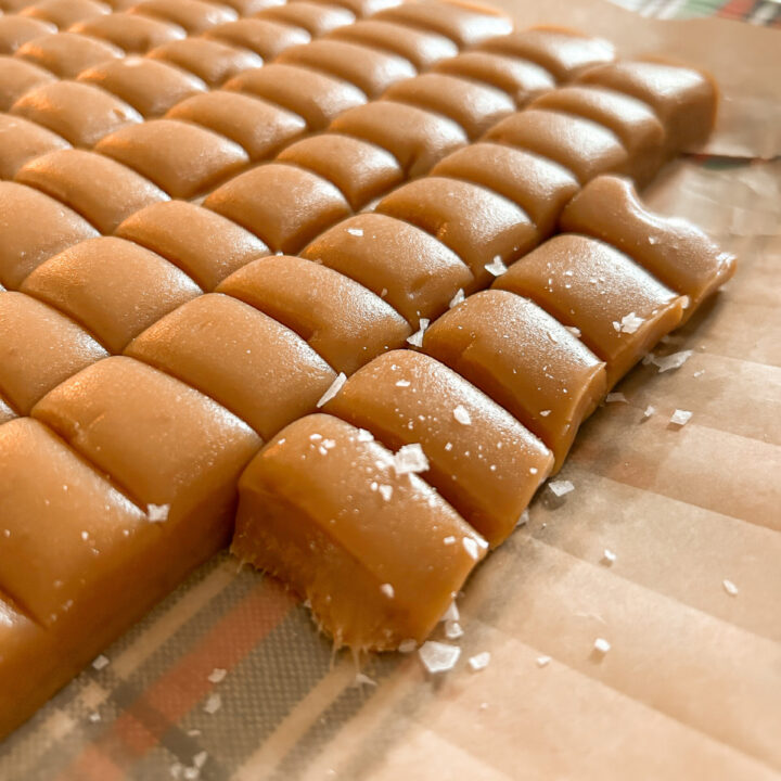 close up of homemade caramels sprinkled with flakey sea salt