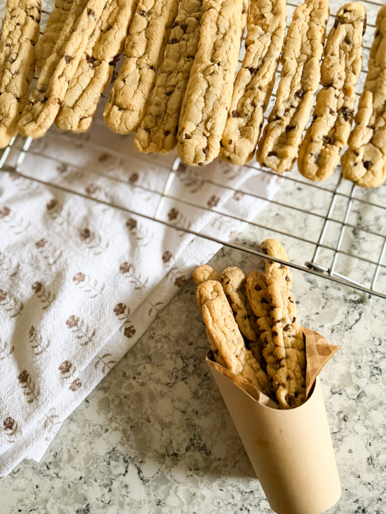 Chocolate chip cookie fries on a cooling rack and served in a Kraft fry container.